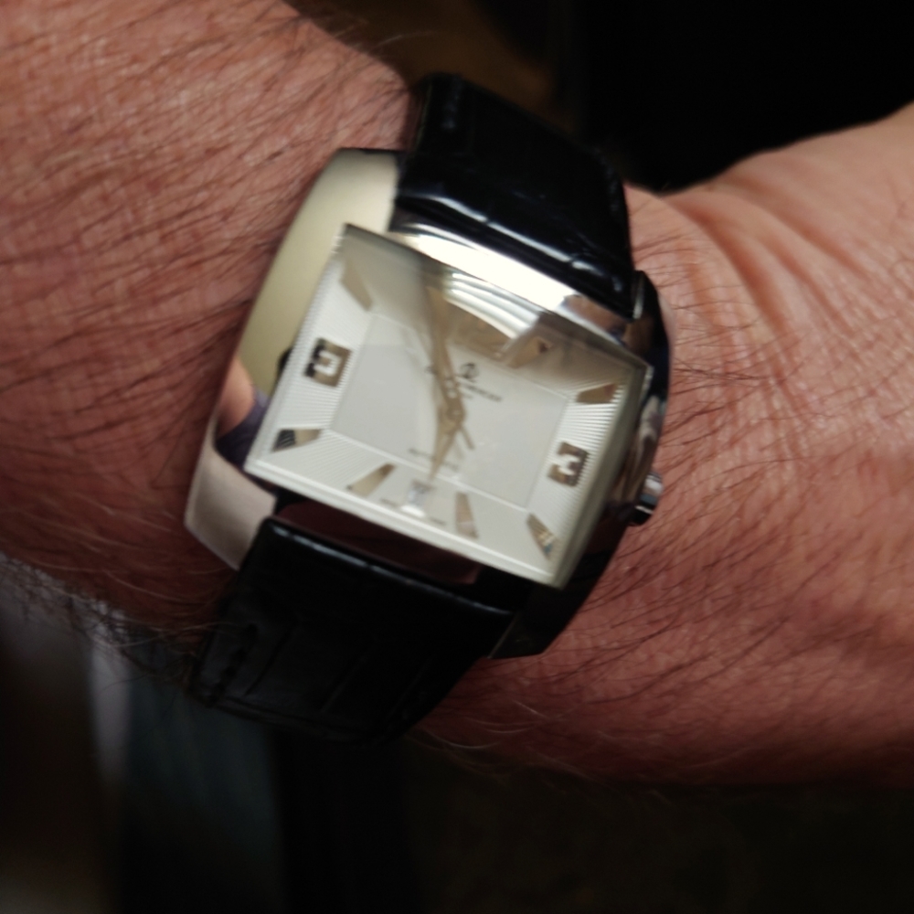 Baume and Mercier men watch, automatic, pre owned.